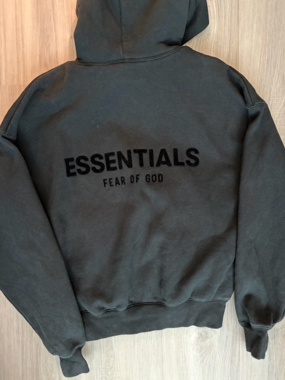 Essentials Black Pullover Hoodie with Subtle Branding